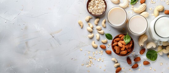 Poster - Assorted vegan almond and cashew milk displayed on a table with a top view featuring a copy space image