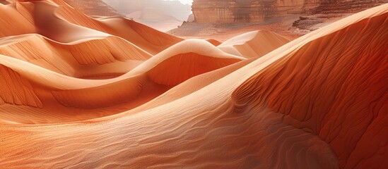 Wall Mural - A scenic landscape of the undulating sand formations in the Arabian desert ideal for a copy space image