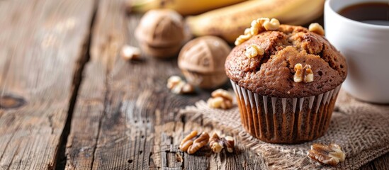Poster - Close up of a banana nut muffin served alongside coffee for breakfast on a vintage rustic wood kitchen table The image features selective focus and copy space