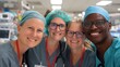 © Pinklife - A diverse group of medical professionals smiling and embracing each other in a hospital environment, showcasing camaraderie, teamwork, and dedication in healthcare service.