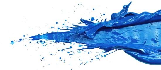 Canvas Print - A blue paint splash on a white background with ample copy space image