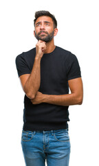 Poster - Adult hispanic man over isolated background with hand on chin thinking about question, pensive expression. Smiling with thoughtful face. Doubt concept.