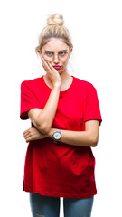 Poster - Young beautiful blonde woman wearing red t-shirt and glasses over isolated background thinking looking tired and bored with depression problems with crossed arms.