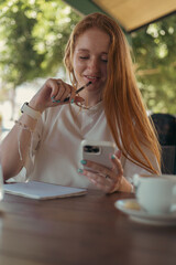 woman in cafe working or studying