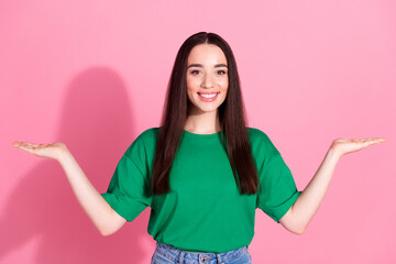 Sticker - Photo of shiny attractive lady dressed green t-shirt comparing arms empty space isolated pink color background