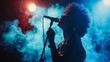 © liliyabatyrova - A female singer with an afro hairstyle performs on a stage lit by blue lights, with smoke swirling around her
