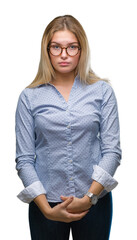 Poster - Young caucasian business woman wearing glasses over isolated background with serious expression on face. Simple and natural looking at the camera.