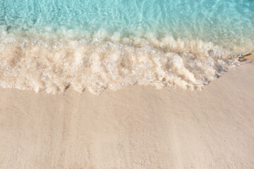 Wall Mural - Sea waves rolling on beautiful sandy beach. Summer vacation