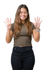 Canvas Print - Young beautiful brunette woman over isolated background showing and pointing up with fingers number nine while smiling confident and happy.