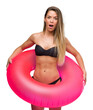 © Krakenimages.com - Beautiful young woman in bikini holding pink float scared in shock with a surprise face, afraid and excited with fear expression