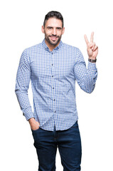 Sticker - Young handsome man over isolated background smiling with happy face winking at the camera doing victory sign. Number two.