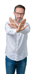 Sticker - Handsome middle age elegant senior business man wearing glasses over isolated background Rejection expression crossing arms and palms doing negative sign, angry face