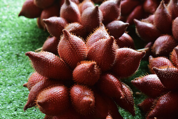 Sala is a brown fruit with a sweet taste that is placed on the ground.