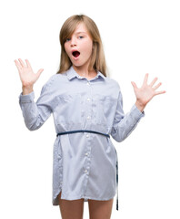 Sticker - Young blonde toddler wearing blue shirt very happy and excited, winner expression celebrating victory screaming with big smile and raised hands