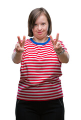 Wall Mural - Young adult woman with down syndrome over isolated background smiling looking to the camera showing fingers doing victory sign. Number two.