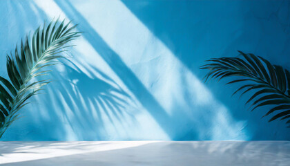 Wall Mural - Blurred shadow from palm leaves on the light blue wall. Minimal abstract background for product presentation. Spring and summer.