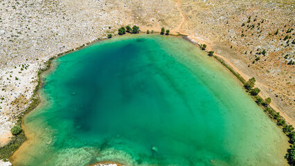 Wall Mural - The aerial views of Green Lake, a crater lake, is on the Gömbe Plateau, famous for its unique geographical riches.