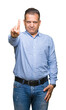 © Krakenimages.com - Middle age arab business man over isolated background Pointing with finger up and angry expression