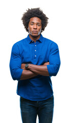 Canvas Print - Afro american man over isolated background skeptic and nervous, disapproving expression on face with crossed arms. Negative person.