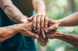© Alberto Gonzalez  - Teamwork concept with group of friends putting their hands together
