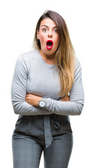 Wall Mural - Young beautiful worker business woman over isolated background afraid and shocked with surprise expression, fear and excited face.