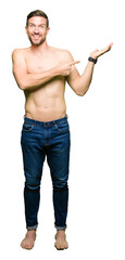 Poster - Handsome shirtless man showing nude chest amazed and smiling to the camera while presenting with hand and pointing with finger.