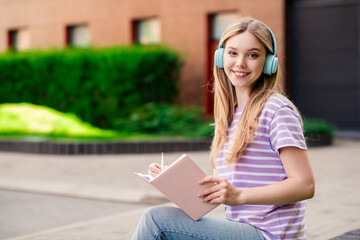 Sticker - Photo of adorable sweet lady wear striped t-shirt earphones writing planner enjoying walking outdoors urban city street