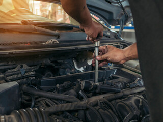 Wall Mural - Close up Man hands fixing Car machinery vehicle mechanical service. Mechanic man hands repairing car auto repair shop. open vehicle hood checking up auto mobile. Vehicle Car maintenance engineer.