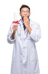 Sticker - Adult hispanic doctor man holding degree over isolated background cover mouth with hand shocked with shame for mistake, expression of fear, scared in silence, secret concept