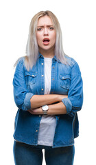 Canvas Print - Young blonde woman over isolated background skeptic and nervous, disapproving expression on face with crossed arms. Negative person.