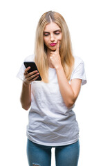 Sticker - Young beautiful blonde woman using smartphone over isolated background serious face thinking about question, very confused idea