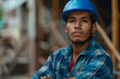 © Babb - A man wearing a blue hard hat and a plaid shirt is posing for a picture