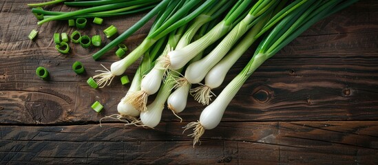 Sticker - Top view of fresh green onions on a table with copy space image