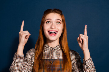 Canvas Print - Photo of shocked funky lady lady dressed plaid outfit looking showing two fingers up empty space isolated dark blue color background