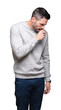 © Krakenimages.com - Young handsome man wearing sweatshirt over isolated background feeling unwell and coughing as symptom for cold or bronchitis. Healthcare concept.