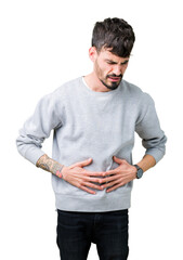 Sticker - Young handsome man wearing sweatshirt over isolated background with hand on stomach because indigestion, painful illness feeling unwell. Ache concept.