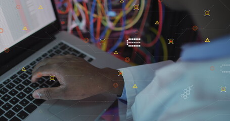 Wall Mural - Image of data processing over african american male engineer using laptop at server room