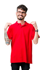 Sticker - Young handsome man wearing glasses over isolated background looking confident with smile on face, pointing oneself with fingers proud and happy.