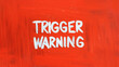 © Rita Paulina Kłysik - Red background trigger warning sign. Mental triggering concept.