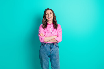 Wall Mural - Photo of adorable lovely woman wear pink shirt arms crossed empty space isolated blue color background