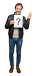 © Krakenimages.com - Handsome middle age man holding paper with question mark very happy pointing with hand and finger to the side