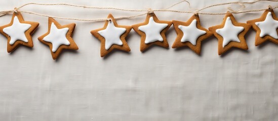 Sticker - Star-shaped gingerbread cookies with royal icing decoration on a linen backdrop, ideal for the holiday season with a suitable copy space image.