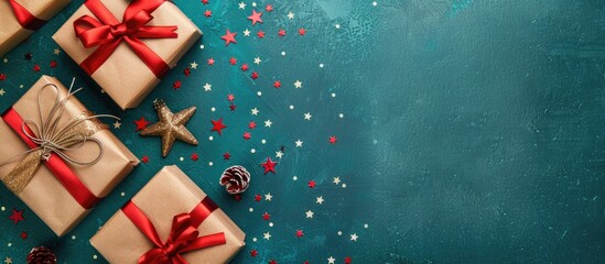 Canvas Print - Top view Christmas composition with gift boxes and stars on a background, providing copy space for text, arranged in a flat lay style.