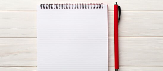 Poster - Business concept with red notepad and open notepad on a white wooden table with a pen, ideal for copy space image.