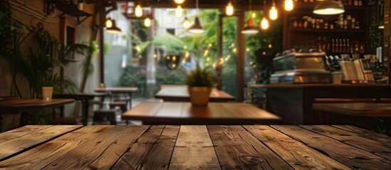Poster - Empty brown wooden table with selected focus and blur Coffee shop background, perfect for photomontage or product display with copy space image.