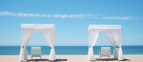 Poster - An image of tranquil beach booths with white curtains under a clear blue sky, evoking a seaside vacation vibe. Ample space for text or design.