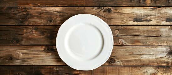 Aufkleber - A white plate placed on a wooden table with ample copy space image included.