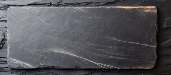 Aufkleber - Black stone slate board on a white surface with a texture perfect for copy space image.