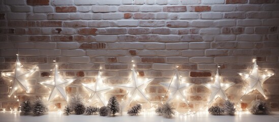 Poster - Festive holiday arrangement with white wooden stars and trees, silver fairy lights, set against a textured white backdrop next to a brick wall, featuring copy space image.