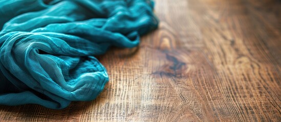 Aufkleber - Walnut wood table background with a teal linen cloth, featuring a shallow focus for copy space image.